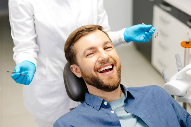 friendly dentist with patient